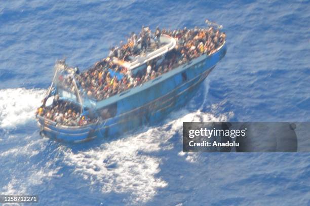 Photo shows the boat carrying migrants before it sank, in Kalamata, Greece on June 15, 2023. Rescued immigrants of a shipwreck after a boat carrying...