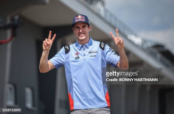 Ducati Spanish rider Alex Marquez gestures during riders track familiarisation at the Sachsenring racing circuit in Hohenstein-Ernstthal near...