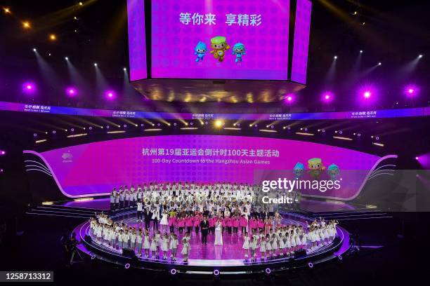 Dancers perform during a ceremony to mark the 100-day countdown to the opening of the 19th Asian Games in Hangzhou, in China's eastern Zhejiang...