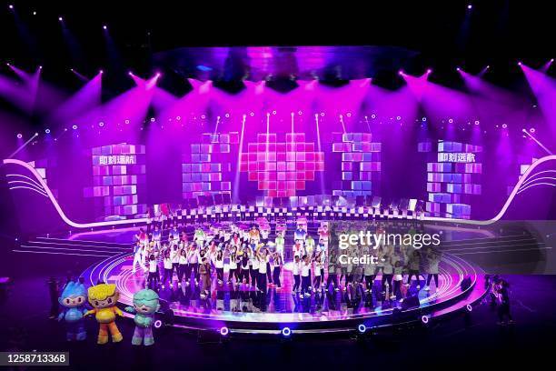 Dancers perform during a ceremony to mark the 100-day countdown to the opening of the 19th Asian Games in Hangzhou, in China's eastern Zhejiang...