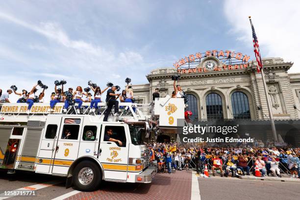 The Denver Nuggets dancers wave to the crowd during the Denver Nuggets victory parade and rally after winning the 2023 NBA Championship on June 15,...