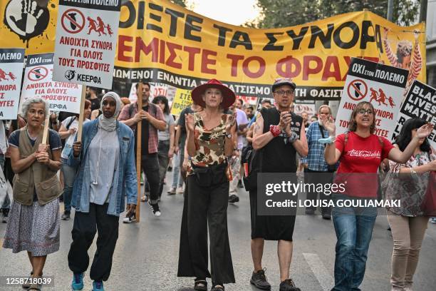Protesters chant slogans during a demonstration to protest against the EU and Greek government's policies following a deadly shipwreck which costed...
