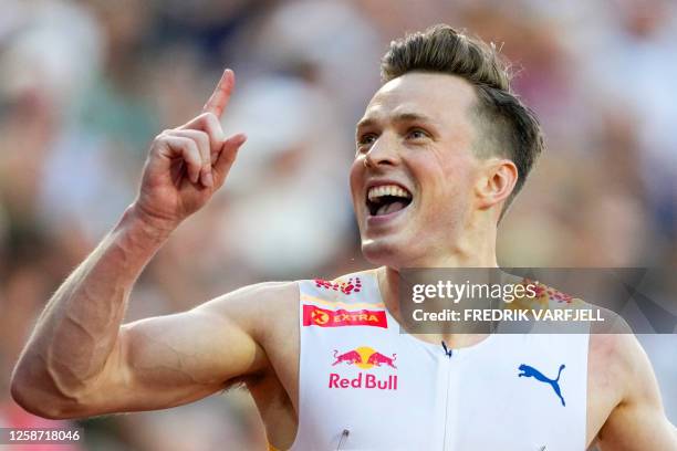 Norway's Karsten Warholm celebrates winning the 400 meter men's hurdles competition at Bislett Stadium during the Oslo Diamond League competition in...