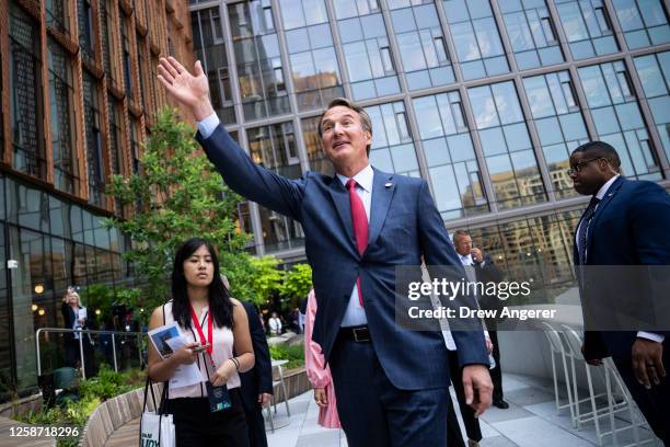 Virginia Governor Glenn Youngkin waves as he tours Amazon HQ2 during their grand opening ceremony on June 15, 2023 in Arlington, Virginia. The first...