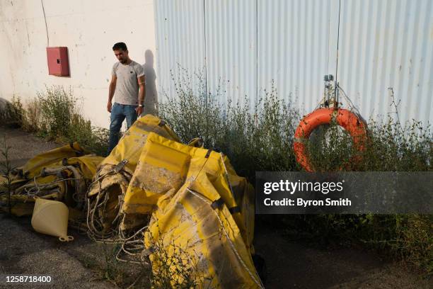 Majd Zatima of Syria, who currently resides in the Netherlands, seeks information on his brother who was on the capsized boat, outside of the hangar...