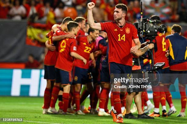 Spain's defender Aymeric Laporte celebrates with teammates after winning the UEFA Nations League semi final football match between Spain and Italy at...