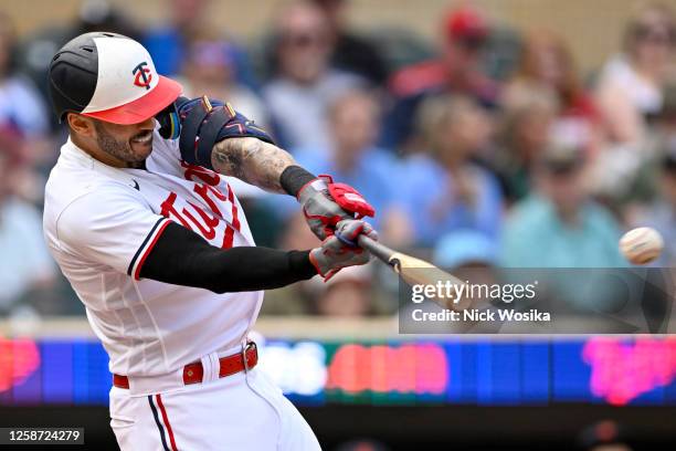 Carlos Correa of the Minnesota Twins hits a double against the Detroit Tigers during the first inning at Target Field on June 15, 2023 in...