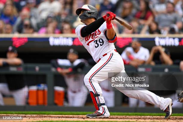 Donovan Solano of the Minnesota Twins hits a three-run home run against the Detroit Tigers during the second inning at Target Field on June 15, 2023...