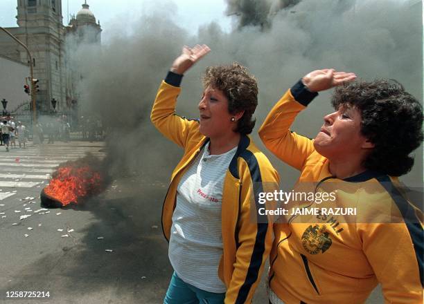 Laid off municipal workers protest by burning tires in the streets of central Lima, 03 March. They are protesting the OAS's ignoral of a court...