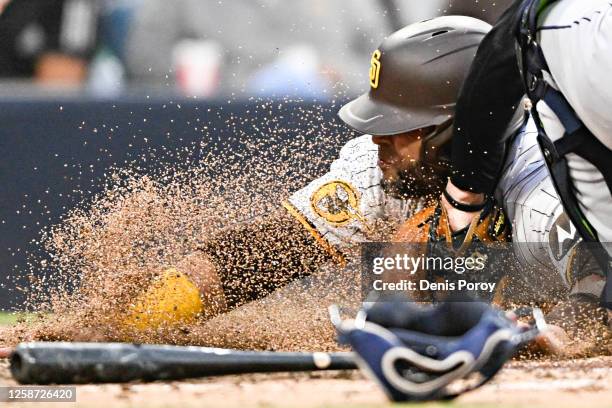 Nelson Cruz of the San Diego Padres is tagged out by David Fry of the Cleveland Guardians during the fifth inning of a baseball game June 15, 2023 at...