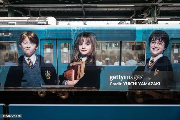 Train adorned with Harry Potter characters are seen at Nerima station near the theme park "Warner Bros. Studio Tour Tokyo - The Making of Harry...
