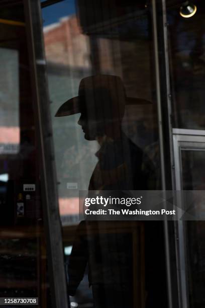 Silhouette of a man in a cowboy hat in Casper, United States, seen on June 8, 2023.