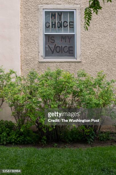 Words in a window reading "my choice is my voice" across the street from Wellspring Health Access clinic in Casper, United States, seen on June 8,...