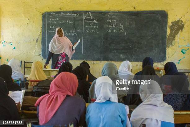 Picture taken on June 15 shows students attending a lesson at a secondary school for girls in Wad Madani, the capital of Sudan's al-Jazirah state,...