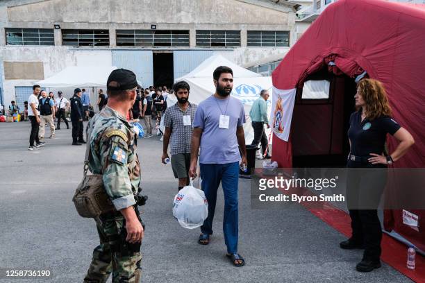 Shipwreck survivors await transfer to a refugee camp near Athens on June 16, 2023 in Kalamata, Greece on June 16, 2023 in Kalamata, Greece. A fishing...