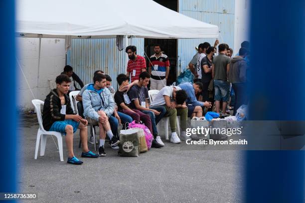 Shipwreck survivors await transfer to a refugee camp near Athens on June 16, 2023 in Kalamata, Greece on June 16, 2023 in Kalamata, Greece. A fishing...