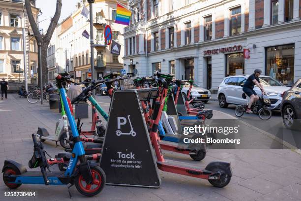 Electric scooters for hire at a parking bay in Stockholm, Sweden, on Tuesday, June 13, 2023. A price measure that strips out energy costs and the...