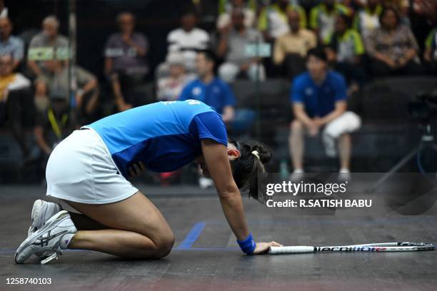 Japan's Satomi Watanabe gestures as she plays against Egypt's Fayrouz Aboelkheir during their semifinal match at the SDAT WSF Squash World Cup 2023...