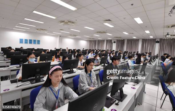Referees judge the scanned test papers of a Gaokao exam in Nanjing in east China's Jiangsu province.