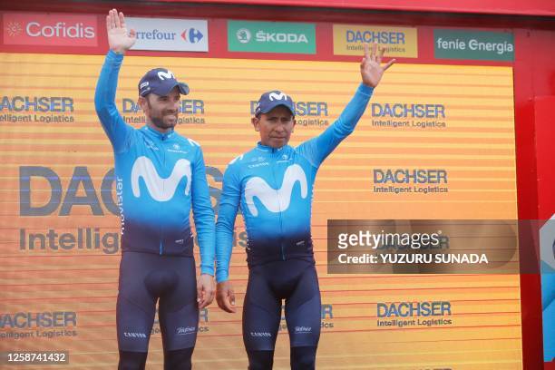 Spanish Alejandro Valverde of Movistar Team and Colombian Nairo Quintana of Movistar Team celebrate on the podium of the 15th stage of the 'Vuelta a...