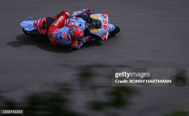 Ducati Gresini Racing MotoGP Team's Italian rider Fabio Digiannantonio steers his motorbike during the second free practice for the MotoGP German...