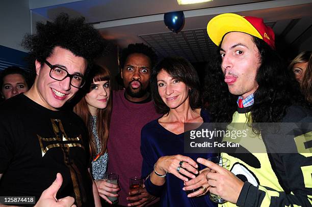 Three musicians members of the 'Twin twin' band and two girl friends attend the Bal Jaune Fiac 2010 at the Pavillon Cambon Capucines on October 22,...