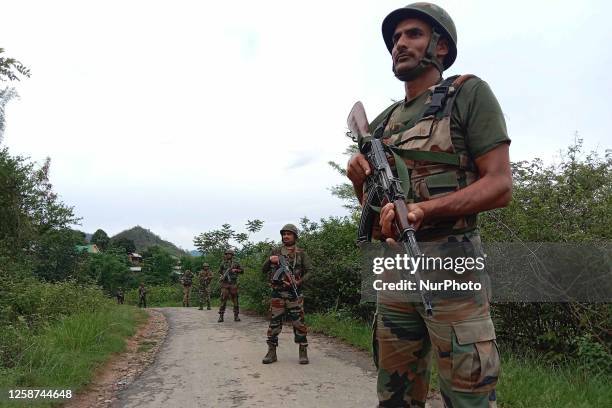 Indian Army officials patrol in the violence-hit area in India's north-eastern Manipur state on June 16, 2023.