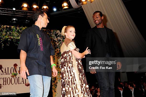 Presenter Victoria Monfort dressed by Christophe Roussel and high fashion designer Imane Ayissi attend the Salon Du Chocolat 2010 - Opening Night at...