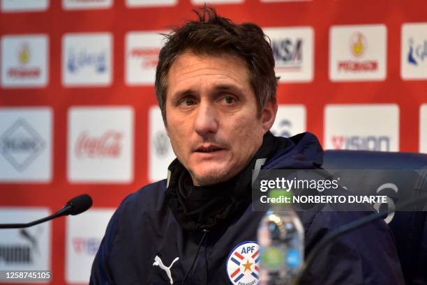 Paraguay's coach Argentine Guillermo Barros Schelotto speaks during a presser following a training session in Asuncion, on June 16 ahead of their...