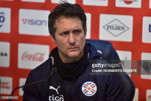 Paraguay's coach Argentine Guillermo Barros Schelotto listens to a question during a presser following a training session in Asuncion, on June 16...