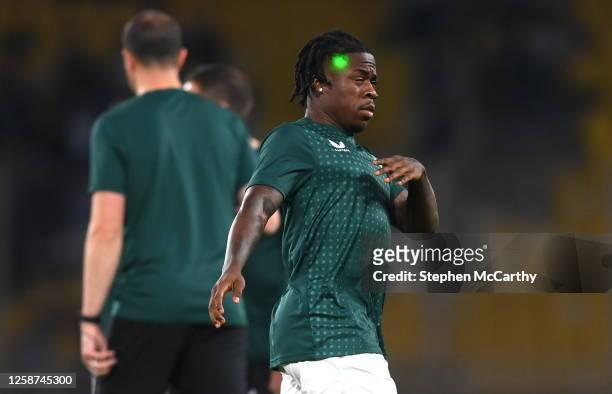 Athens , Greece - 16 June 2023; A laser is seen shining on the head of Michael Obafemi of Republic of Ireland during the warm-up before the UEFA EURO...