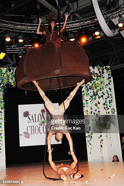 Singer Irene Salvador dressed by Patrice Chapon and acrobats from the 'Farfadais' attend the Salon Du Chocolat 2010 - Opening Night at the Parc des...