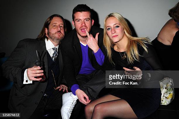 Chronicler/writer Tristan Ranx and DJ/ journalist Cedric Couvez and his girl friend Marion attend the Bal Jaune Fiac 2010 at the Pavillon Cambon...