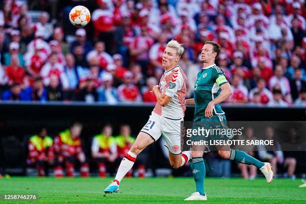 Denmark's forward Rasmus Hojlund and Northern Ireland's defender Jonny Evans vie for the ball during the UEFA Euro 2024 group H qualification...