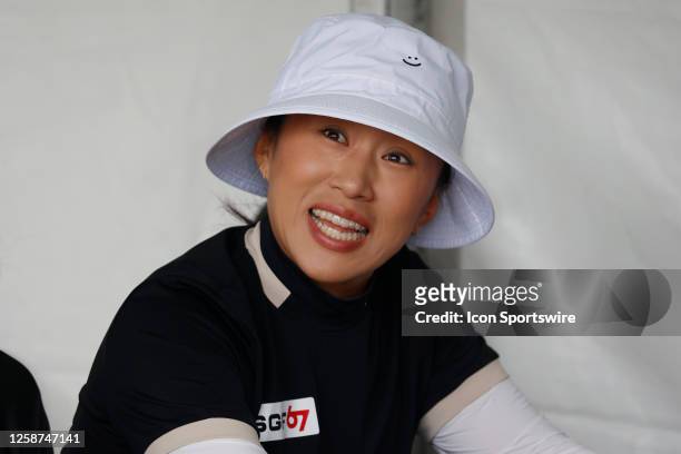 Golfer Amy Yang smiles while signing her score card while currently being in second place after playing her second round on June 16 during the LPGA...