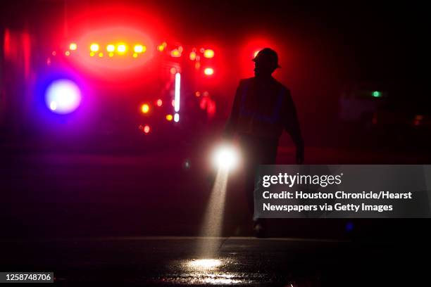 Centerpoint Energy employee is seen surveying the damage from a fire at the Iglesia Cristiana Monte Sinai in the Solon Business park on Solon Road in...