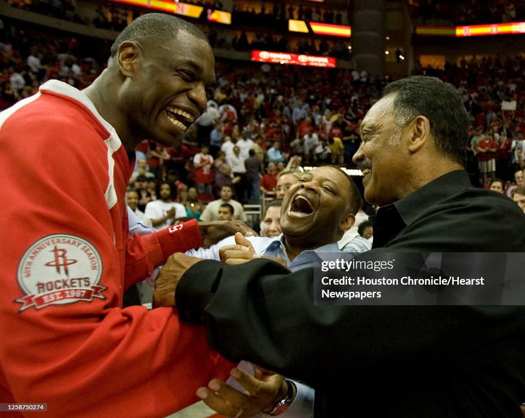 Mutamba Houston Rockets Houston Rockets center Dikembe Mutombo , celebrates with Rev. Jesse ...