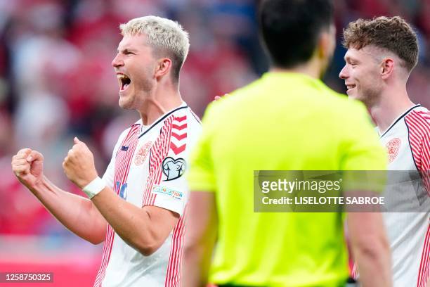 Denmark's forward Jonas Wind celebrates scoring during the UEFA Euro 2024 group H qualification football match between Denmark and Northern Ireland...