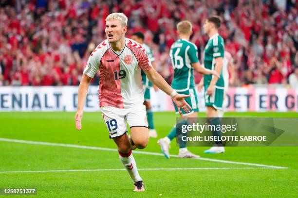 Denmark's forward Jonas Wind celebrates scoring the 1-0 during the UEFA Euro 2024 group H qualification football match between Denmark and Northern...