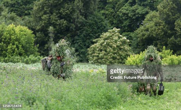 Camouflaged drone pilots are seen in the field as as the Army of Drones announces the second stage of the UAV pilot training that will see 10,000...