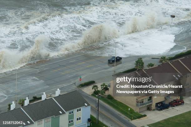 Waves crash over the seawall on Galveston Island as Hurricane Ike approaches the Texas Gulf Coast, Friday, Sept. 12, 2008.
