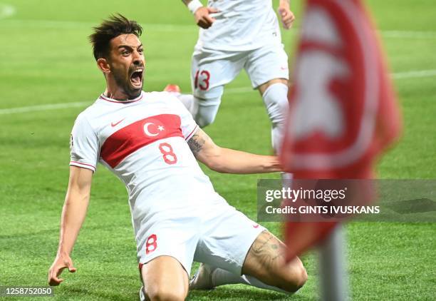 Turkey's midfielder Irfan Kahveci celebrates scoring during the UEFA Euro 2024 group D qualification football match between Latvia and Turkey in Riga...