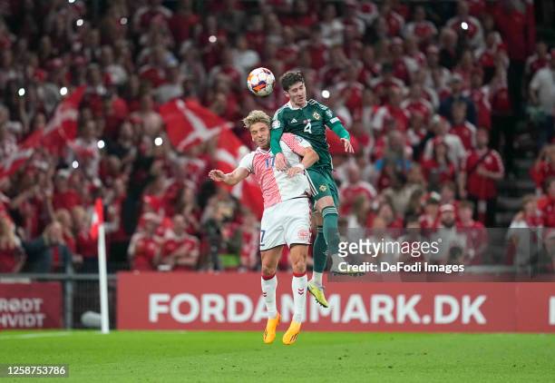 Jens Stryger of Denmark and Trai Hume of Northern Ireland battle for the ball during the UEFA EURO 2024 qualifying round group H match between...