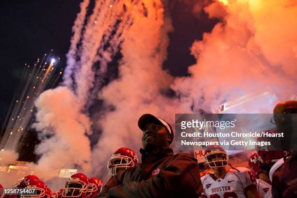 Head coach Kevin Sumlin watches fireworks explode over the stadium before the Houston Cougars take the field against UTEP at the Sun Bowl Saturday,...