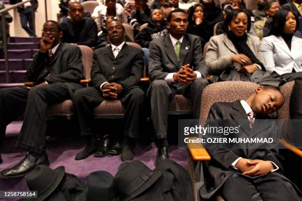 People listen during funeral services for Coretta Scott King07 February 2006 at the New Birth Missionary Baptist Church in Lithonia, GA. Americans...