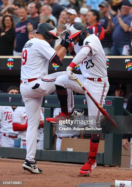 Alex Kirilloff and Royce Lewis of the Minnesota Twins celebrate Kirilloff's solo home run in the second inning against the Detroit Tigers at Target...