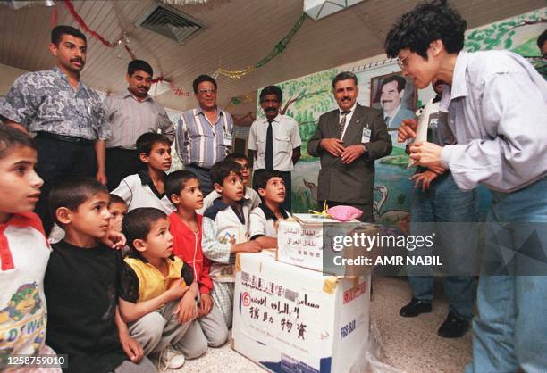 Ito Masako , chairman of the Children Friendlyship Society between Japan and the Arab countries, offers to Iraqi orphans gifts from Janesese...