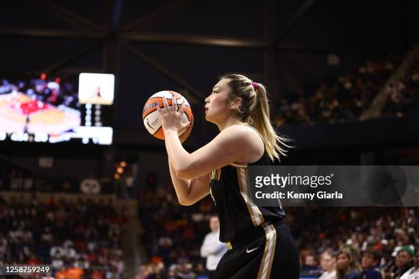 Li Meng of the Washington Mystics shoots a three point basket during the game against the Phoenix Mercury on June 16, 2023 at Entertainment and...