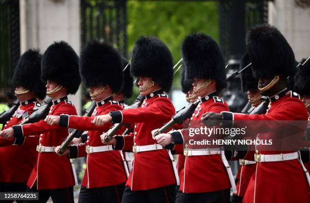 Coldstream Guards, a regiment of the Household Division Foot Guards, parade down The Mall during the King's Birthday Parade, 'Trooping the Colour',...