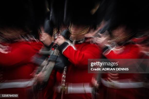 Members of different Households Divisions Foot Guards, parade down The Mall during the King's Birthday Parade, 'Trooping the Colour', in London on...